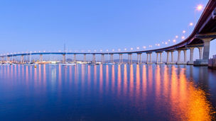 Coronado Bridge at Dusk - A close-up dusk view of Coronado Bridge, winding over calm San Diego Bay, at San Diego, California, USA.