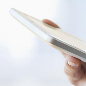 Man typing on a tablet