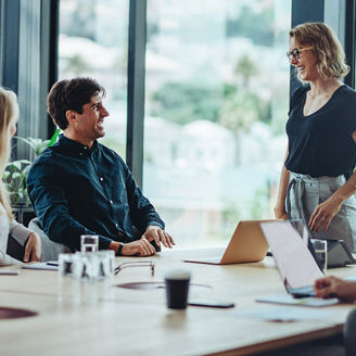 two women and man meeting