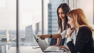 two woman laptop