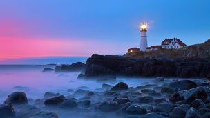 Early morning light reflects off clouds on  Portland Head Lighthouse