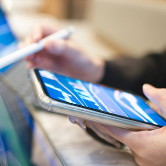 Asian women with Ai technology in her eyeglasses with digital tablet  city background