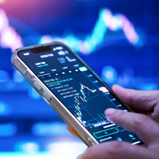 Business Woman holding a phone,Business people using mobile phones to check market data,Stock market