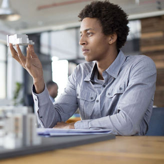 A man is looking at an object