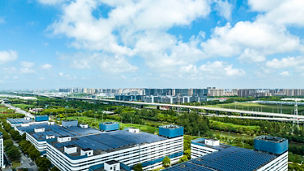 Aerial view of solar panels on manufacturing factory building roof at Shanghai free trade zone,China.