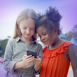 Two children using phone