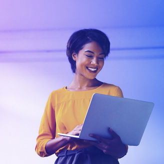 Outdoor shot of young woman using mobile phone outdoors in the city. Female business professional using smart phone in the city.