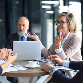 Portrait of a positive business employees at an office business meeting