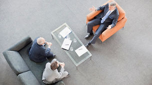 Businessmen meeting in lobby
