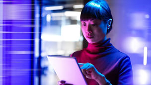 Futuristic office with Japanese mature businesswoman