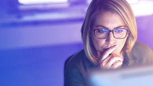 Outdoor shot of young woman using mobile phone outdoors in the city. Female business professional using smart phone in the city.