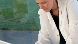 Doctors working with computer