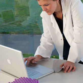 Doctors working with computer