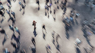 Businesswoman talking on the phone in the crowds of people. 3D generated image.