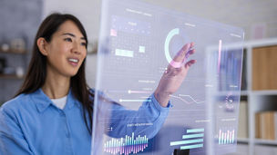Woman Using Futuristic Transparent Monitor to Control Smart Home System