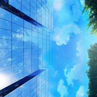 木と青空を持つ近代的なビジネスビル