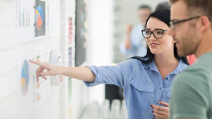 Cape Town, South Africa, colleagues conversing about charts