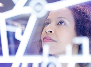 Woman looks at formula