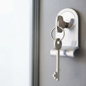 Close up of key in a front door