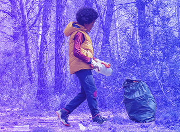 A kid collecting waste