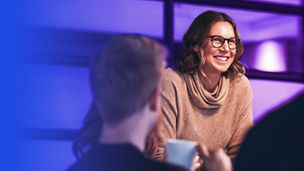Woman laughing in meeting