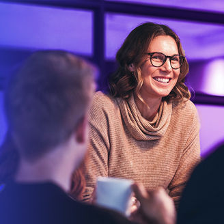 Woman laughing in meeting