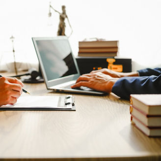 Legal expert navigating corruption cases, including bribery and graft. Businessman consults at desk. Discussions involve bribery, corruption, buying off, and corrupt practices.