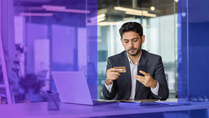 Man with credit card and mobile phone