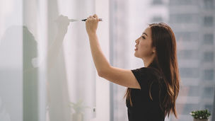  woman standing on white wall