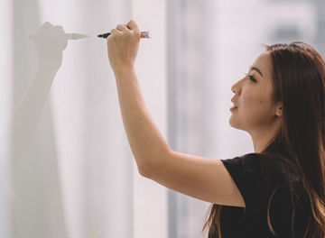  woman standing on white wall