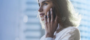 woman in front of skyscraper 