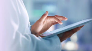 nurse working on tablet