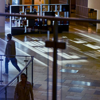 Man is walking through the KPMG office