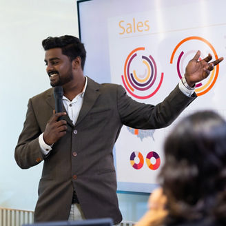 Presentation - Handsome indian business man people giving presentation and Report pointing at projector or TV screen. People Work in Business Office.