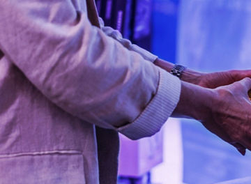 Customer with bananas at the self-checkout system