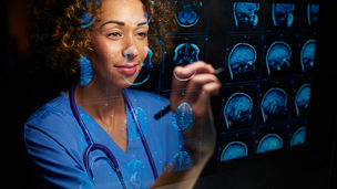 Lady doctor looking at head x-ray