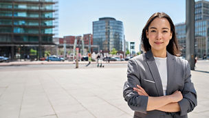 Lady in grey blazer smiling