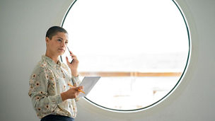 Lady with notebook talking over phone