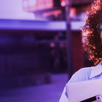 Lady with spectacles talking on phone purple tint banner