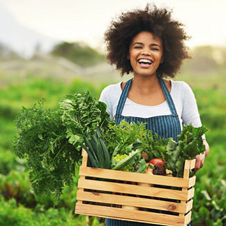 Laughing woman in garden patch