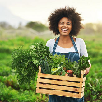 Laughing woman in garden patch