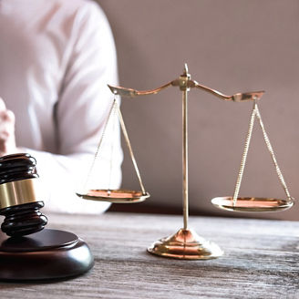 Legal law, advice and justice concept, Professional male lawyers working on courtroom sitting at the table and signing papers with gavel and Scales of justice.