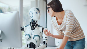 Woman talking to AI robot