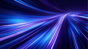 Abstract image of blue, purple, and pink light streaks extending across a dark background, converging toward a bright focal point near the upper right corner
