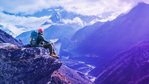Male hiker sitting on mountain