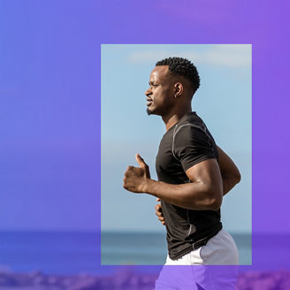 Male runner along beachline