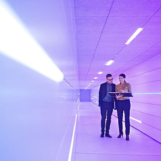 Outdoor shot of young woman using mobile phone outdoors in the city. Female business professional using smart phone in the city.