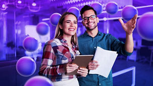 man-and-woman-holding-papers-tablet