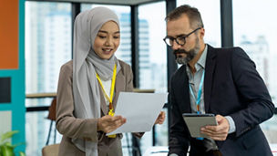 man-and-woman-looking-at-a-sheet-of-paper