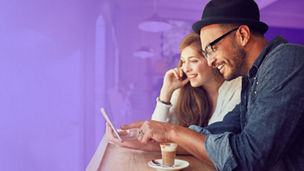 Man and woman looking at phone
